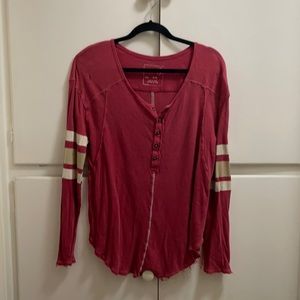 Pink “We the Free” Football Jersey